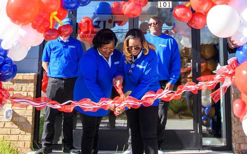 Handel's Ice Cream franchisees Alberta Berhannan and Michelle Evans cutting the ribbon on their new store in Cumming, Georgia