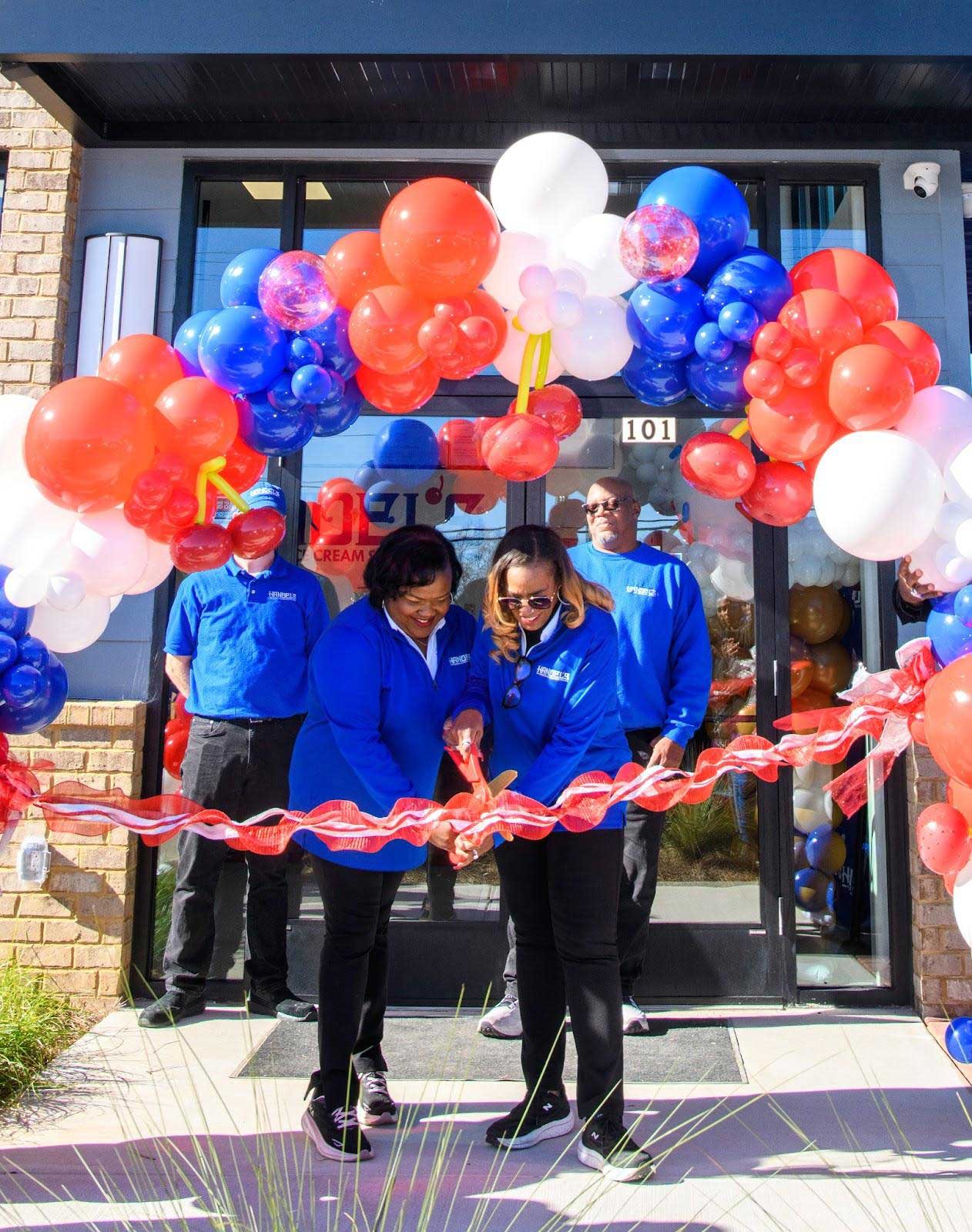 Handel's Ice Cream franchisees Alberta Berhannan and Michelle Evans cutting the ribbon on their new store in Cumming, Georgia